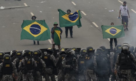 Supporters of former President Jair Bolsonaro clash with security forces as they raid the National Congress in Brasília, Brazil, 8 January 2023.