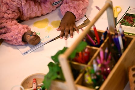 Small child drawing and photo of box of stationary