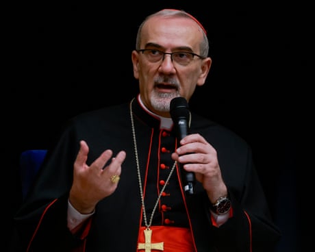 Pierbattista Pizzaballa speaks into a microphone