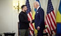 Volodymyr Zelensky and Joe Biden shake hands during talks in Paris on Friday