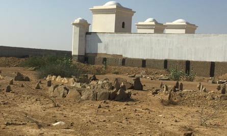 The partially destroyed graveyard in Usman Allah Raki Goth.