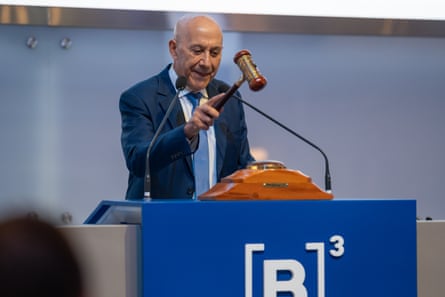 A man raises a gavel.