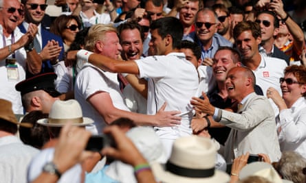 Novak Djokovic celebrates with Boris Becker in the players’ box after winning the men’s final at Wimbledon in 2014