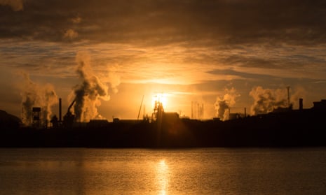 The sun rises behind the Tata steelworks in Port Talbot, Wales.