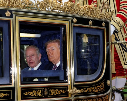 King Charles and Donald Trump sit in a carriage during a procession through Windsor Castle.