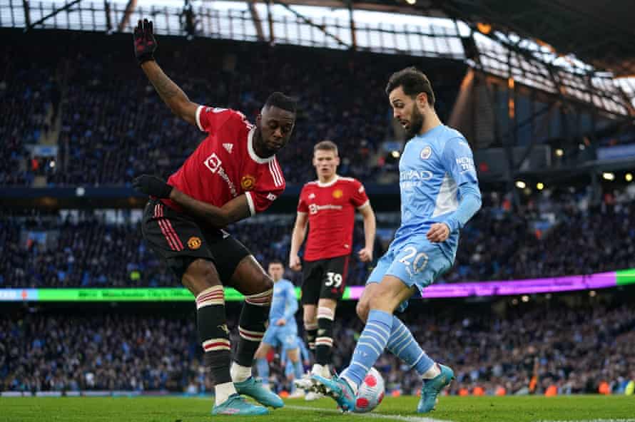 Aaron Wan-Bissaka (left) battles with Manchester City’s Bernardo Silva.