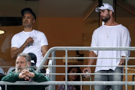 Russell Crowe, Taika Waititi and Chris Hemsworth watch the Rabbitohs’ round-three NRL match against the Roosters in March.