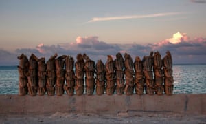 Sandbags line a wall on a causeway on South Tarawa, Kiribati.