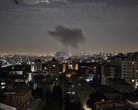 A handout photo released by Iran’s Revolutionary Guards shows smoke billowing from a site in Tehran reportedly targeted by Israeli strikes
