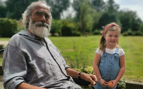 Gordon Brooks, pictured here with his granddaughter Millie, was hospitalised with Covid two days before the vaccine arrived.