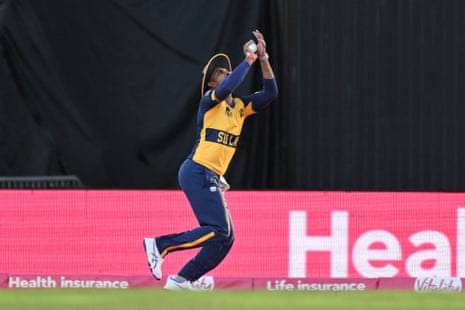 Dasun Shanaka of Sri Lanka catches Aneurin Donald of England off the bowling of Dunith Wellalage.
