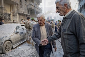 A man covered in dust after being rescued from the site of an Israeli strike in Beirut 