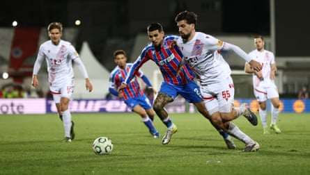 Duje Dujmovic of Zrinjski Mostar runs with the ball while under pressure from Crystal Palace’s Daniel Muñoz.