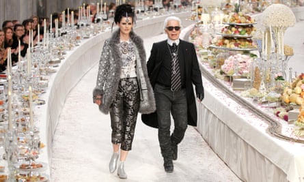 Stella Tennant walks with designer Karl Lagerfeld during the Metiers D’Art show for Chanel in Paris, 2011.