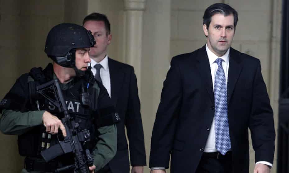 Michael Slager walks from the Charleston County courthouse under protection on 5 December 2016 in South Carolina. 