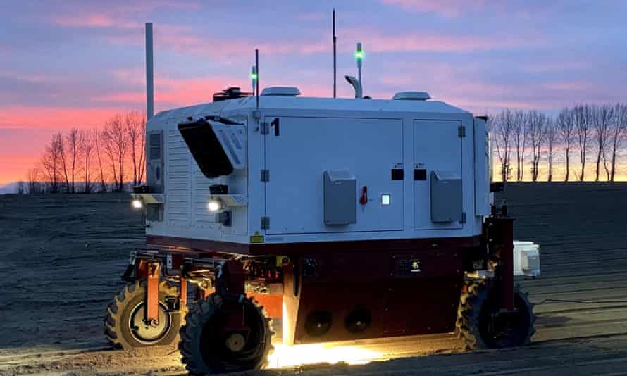 Image of robot weeder using lasers to kill weeds in a field of crops