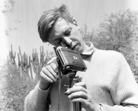 Black and white photograph of David Attenborough at work filming Zoo Quest in 1954