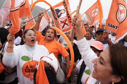 Supporters of Keiko Fujimori with orange banners and balloons