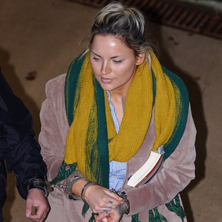 Alice Wood wearing handcuffs