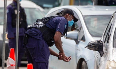 Security officers staff a checkpoint at a junction in Fiji’s capital, Suva.