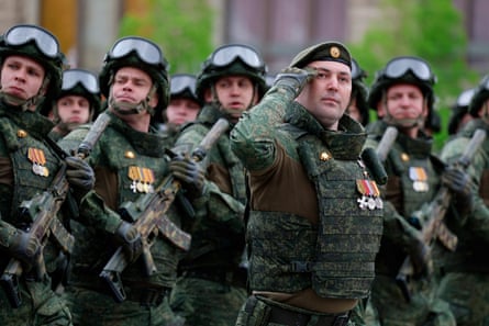 Russian soldiers, who were involved in the military campaign in Ukraine, march in a military parade on Victory Day in Red Square in Moscow.