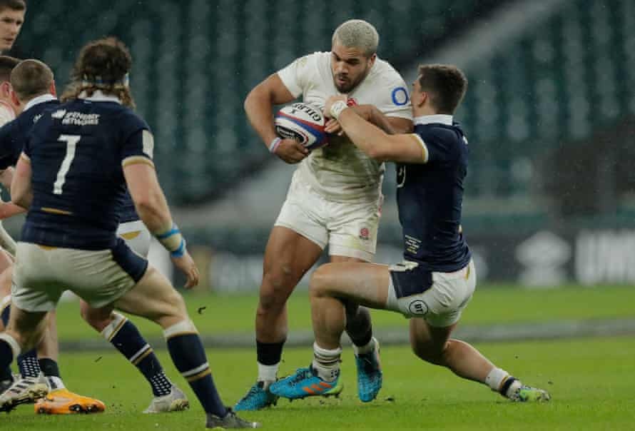 Ollie Lawrence of England is tackled by Cameron Redpath at Twickenham. The two players were centre partners for England’s U20 team as recently as 2019.