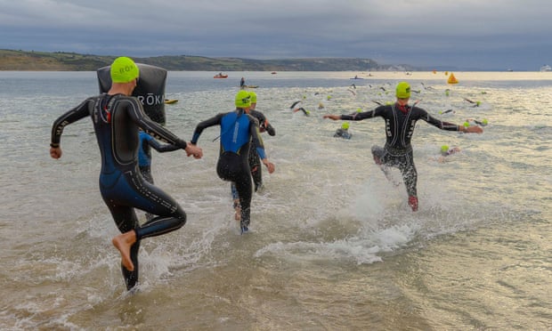 Competitors take part in a triathlon in Dorset. ‘Open’ and ‘female’ categories will apply to any race which is timed or has prizes in the UK.