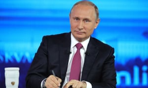 Russian president Vladimir Putin makes notes as he listens to a question during his annual televised call-in show in Moscow on Thursday.