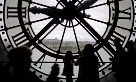 Visitors look through the giant clock at the Musée d'Orsay