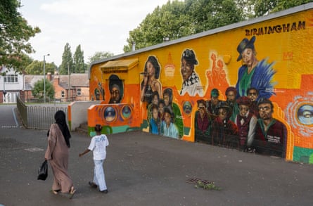 A mural on a wall showing local musicians such as Steel Pulse, Musical Youth and Annette B
