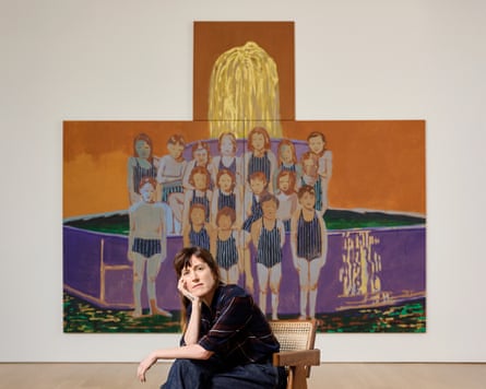 Claire Tabouret sits in front of a large painting of a group of children in swimsuits.