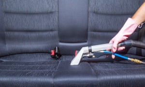 Car interior being cleaned