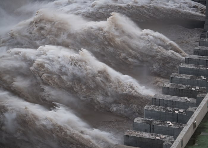 China floods: 100,000 evacuated as waters reach Giant Buddha statue | China | The Guardian