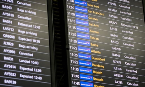 A flight information board displays a number of cancelled British Airways flights at Heathrow Airport Terminal 5 on May 28, 2017