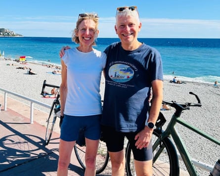 Woman and man by beach in France with their bicycles