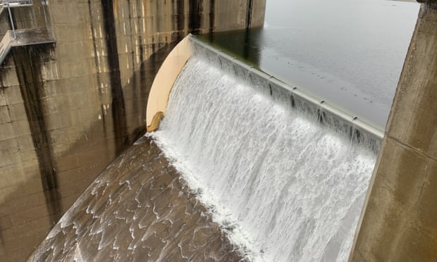 Water spills over the Warragamba Dam in Sydney on Saturday. The spill from the dam is responsible for about half of the flood water in the Hawkesbury-Nepean Valley.