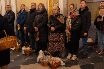 Worshippers including some with Easter baskets