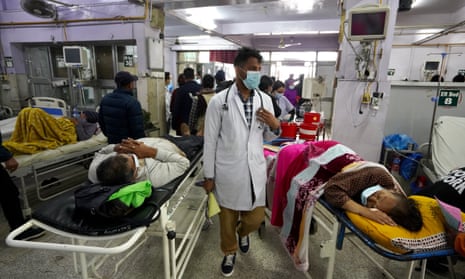 The emergency department at Bir hospital in Kathmandu, which is so busy that staff say patients sometimes have to share beds. 