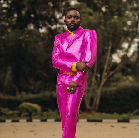 A man in a metallic pink suit.