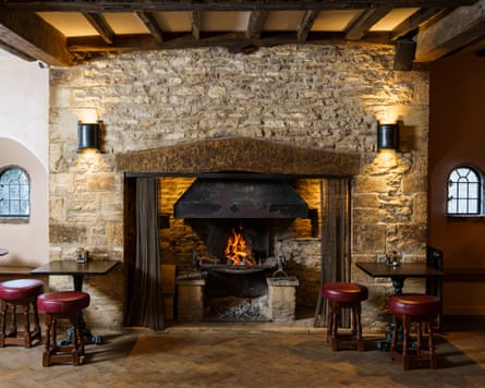 Fireplace in bar area at The Wild Duck, Ewen, Gloucestershire.