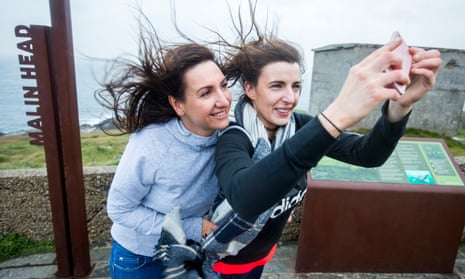 Autumn weather Oct 16th 2017Two Donegal locals take a selfie at Banba’s Crown, Malin Head. Co.Donegal, Ireland, as Hurricane Ophelia hits the UK and Ireland with gusts of up to 80mph. PRESS ASSOCIATION Photo. Picture date: Monday October 16, 2017. Three people have been confirmed dead in Ireland in incidents related to Storm Ophelia. See PA story WEATHER Ophelia Ireland. Photo credit should read: Liam McBurney/PA Wire