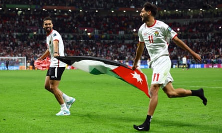 Jordan’s Ali Olwan and Yazan al-Naimat celebrate after reaching the Asian Cup final