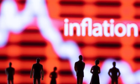  Figurines are seen in front of displayed stock graph and word "Inflation" 