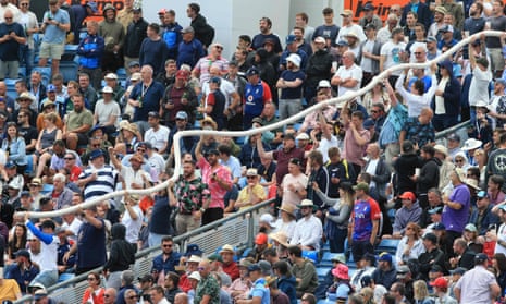 Fans handle a ‘beer snake’ at Headingley.