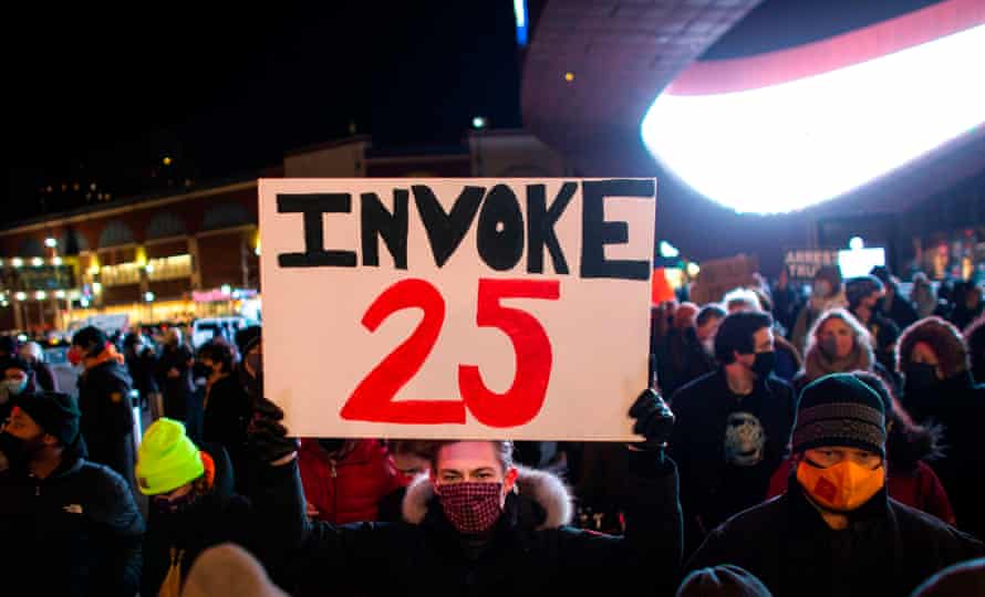 A protester in Brooklyn holds a sign calling for the 25th amendment to remove Donald Trump