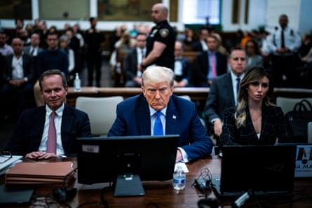 a man looking at the camera in a courtroom