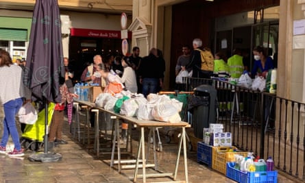 A table full of food, water and baby food outside a cinema in Chiva.