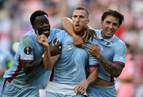 Volnei Feltes (centre) celebrates Torreense's first goal with teammates Malik Abubakari and Joao Marques.