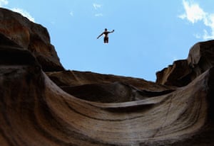 A man jumping off a cliff
