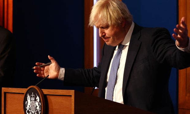 Boris Johnson gestures during a press conference